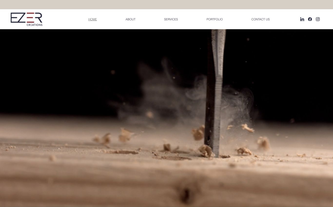 EZER Creations homepage on a laptop